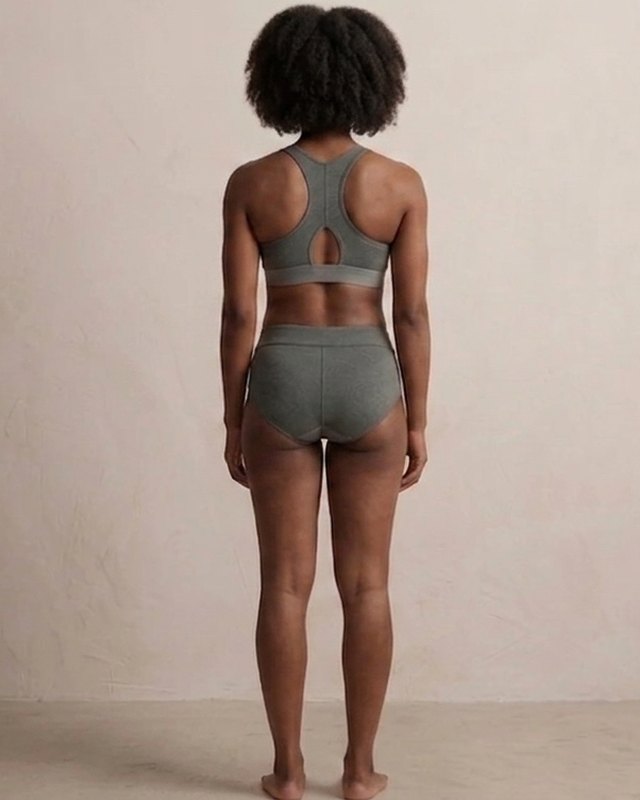 Model 02, back view, wearing the hæld Neo-Form set